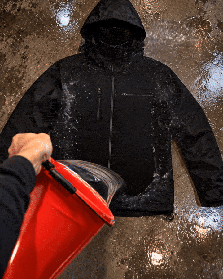 Water reveals the flame and chain design on a black jacket